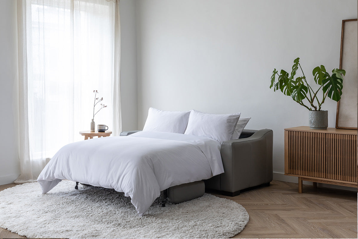 Smart 2.5 Sofa Bed with Pillows Grey Leather by Harvey Norman UK